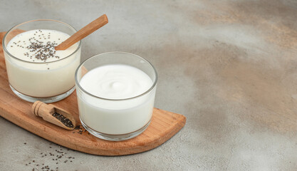 lactose and lactose-free yogurt or kefir, Healthy, clean eating. Vegan or gluten free diet, Long banner format. top view