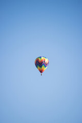 Colorful hot air balloon isolated with clear sky and copy space