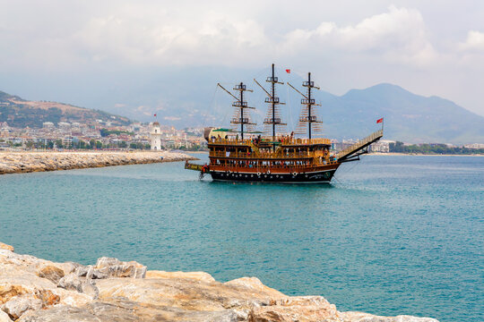 Alanya, Turkey - Aug 08, 2022. Pirate ship in Alanya harbour. Animation tourist ship cruising around Alanya Castle