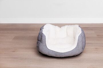 Grey and white empty textile basket bed for dog or cat - Powered by Adobe