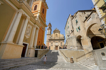 Place de l'Eglise square with Saint Michael Basilica and Immaculate Conception chapel , Menton, France