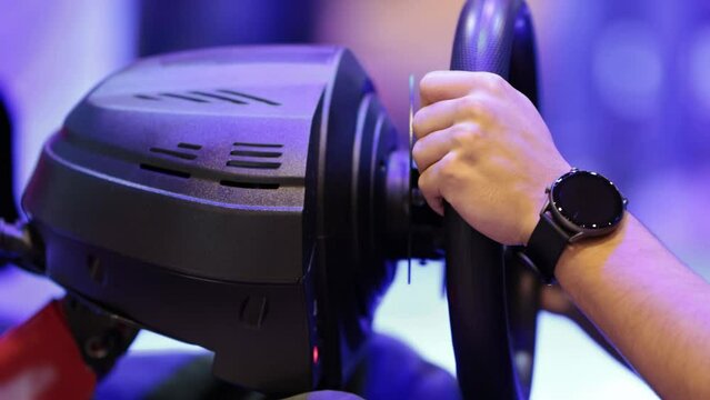 A person tries a racing simulator at a game exhibition
