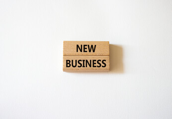 New business symbol. Concept words New business on wooden blocks. Beautiful white background. Business and New business concept. Copy space.