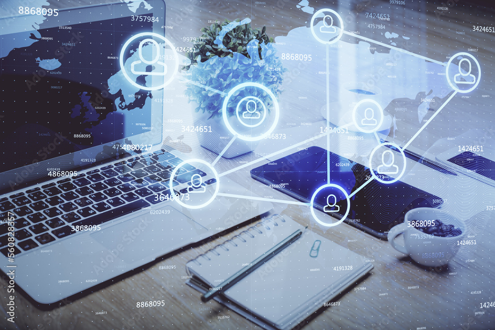 Poster computer on desktop with social network hologram. double exposure. concept of international people c