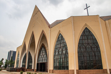 Exterior with arches, crosses, decorative walls of Catholics church in Abuja, church is known as...