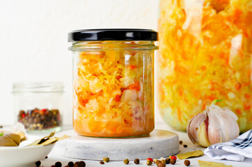 Sauerkraut, Shredded cabbage, apples, and carrots on bright rustic background, Fermented Food, Healthy Eating