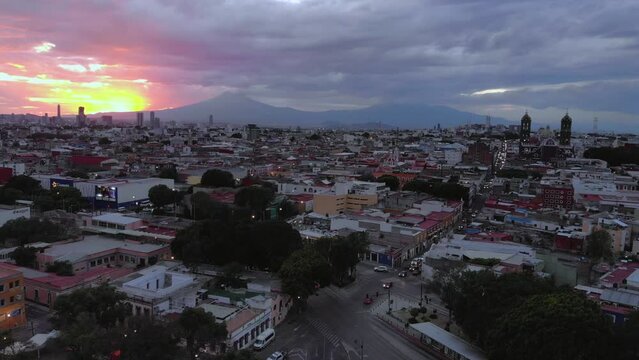 Puebla at Dramatic evening Sunset aerial drone shot of City Center in Puebla de Zaragoza, Puebla State, Mexico