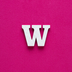 Letter W uppercase - White wood font on rhodamine red background