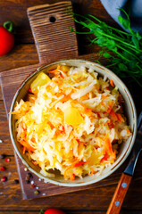 Sauerkraut, Shredded cabbage, apples, and carrots on dark rustic background, Fermented Food, Healthy Eating