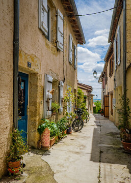 Cute, flowery and narrow streets of the small village of Lectoure in the south of France (Gers)