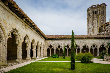 Fototapeta premium The medieval cloister and tower of the Saint Pierre collegial church in La Romieu, south of France (Gers)