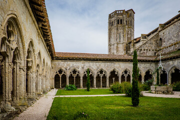 The medieval cloister and tower of the Saint Pierre collegial church in La Romieu, south of France (Gers)
