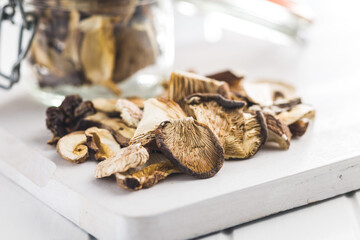 Sliced dried mushrooms on cutting board.