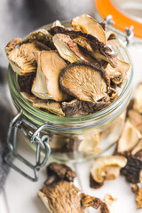 Sliced dried mushrooms in jar.