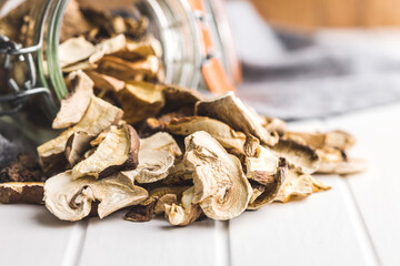 Sliced dried mushrooms in jar.