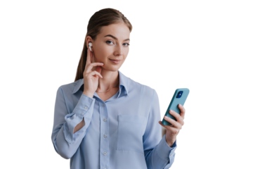 Attractive Blonde young woman in light blue shirt against transparent background listening music using phone, headphones, looking at camera. Pretty Swedish housewife checking sound during video call.