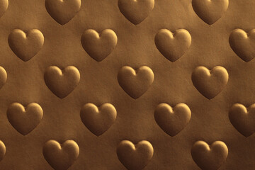 Abstract gold and bronze texture color light shadow background. Paper with relief heart shape.