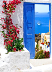 Traditional architecture of Oia village on Santorini island, Greece - 560840137