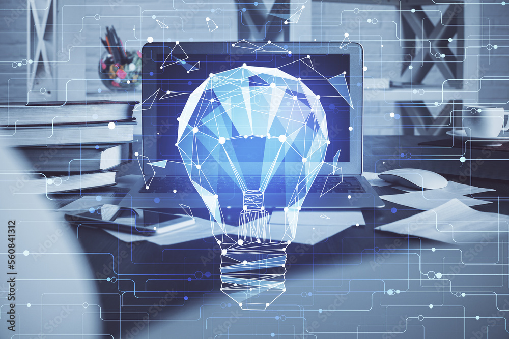 Poster Computer on desktop in office with bulb icon hologram. Multi exposure. Concept of idea.