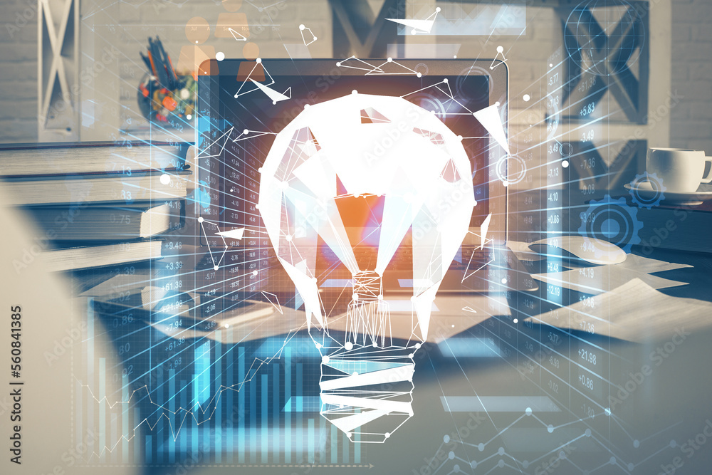 Poster Computer on desktop in office with bulb icon hologram. Multi exposure. Concept of idea.
