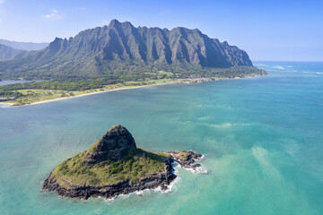 Aerial view of the Koolau Mountain Range on the east side of Oahu with Chinaman's Hat (Mokolii Island) in the foreground