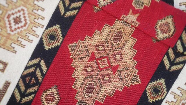Details of traditional Turkish carpet in Istanbul shop, Turkey. Close up of Middle Eastern Arabian carpets in market store.