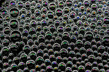 small air bubbles on the surface of the water, Sparkling water. tiny tiny bubbles of foam on the water, liquid close-up background texture