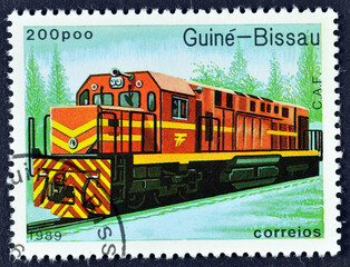Cancelled postage stamp printed by Guinea Bissau, that shows C.a.f. train, circa 1984.