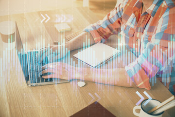 Multi exposure of forex graph with man working on computer on background. Concept of market analysis.