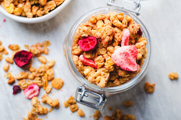 Granola with Dried Berries on Bright Concrete Background, Healthy Vegan Snack or Breakfast