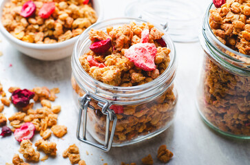 Granola with Dried Berries on Bright Concrete Background, Healthy Vegan Snack or Breakfast