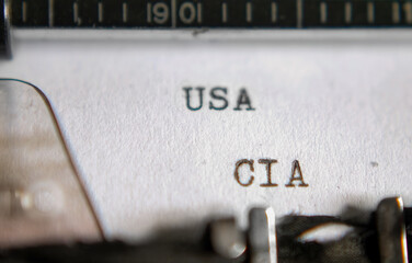 Macro shooting of typewriter red letters "CIA USA" on paper