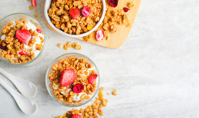Granola and Yogurt Parfaits, Healthy Breakfast or Snack, Muesli with Dried Berries on Bright...