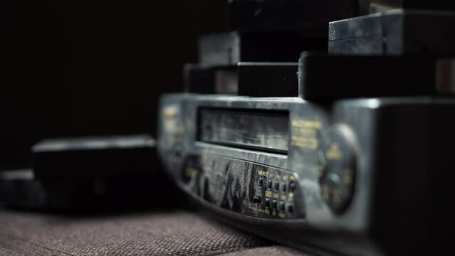 Removing a VHS tape from a VCR