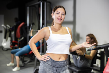 Fototapeta premium Caucasian woman fitness trainer standing in gym