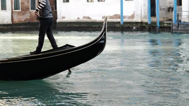 Venice, Italy - gondolas and gondoliers in the Grand Canal near the Rialto Bridge, in the San Marco Basin and between the canals of the lagoon city
