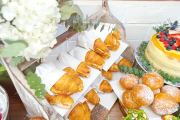 Variety of breads and a cake served at a banquet. Food decoration in a natural way.