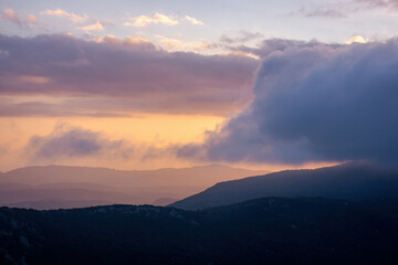 Sunset over the mountains in corfu, Greece