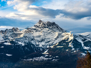 Swiss Alps winter landscape with snow and sun, mountains in Europe