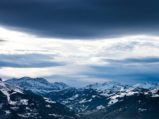 Swiss Alps winter landscape with snow and sun, mountains in Europe