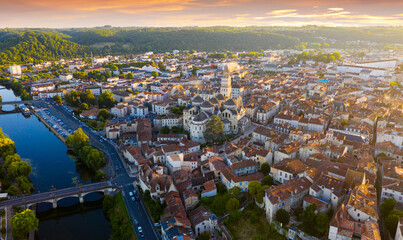 Obraz premium Picturesque aerial view of summer cityscape of Perigueux overlooking medieval Cathedral of Saint Front in rays of setting sun, France..