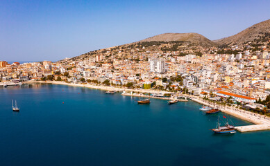 Fototapeta na wymiar Picturesque aerial scenery of Saranda city at Albanian Ionian Sea coast