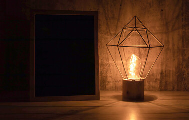 a single light bulb that shine brightly in the dark