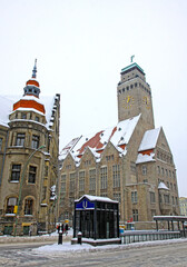 Obraz premium Town Hall (Rathaus) building of Neukolln inner-city locality in Berlin, Germany. Entrance to the U-Bahn Rathaus Neukolln station on a foreground