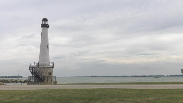 Lighthouse in Celina Ohio on Grand Lake. Shot is a static shot of the lighthouse and the lake. Shot on an overcast day.