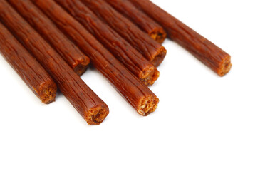 Smoked thin sausages, isolated on white