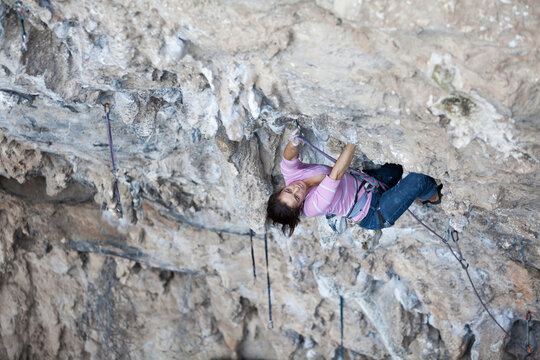 Girl rock climbing at El Chanchuyo (Chonta) cave near Taxco, Guerrero, Mexico.