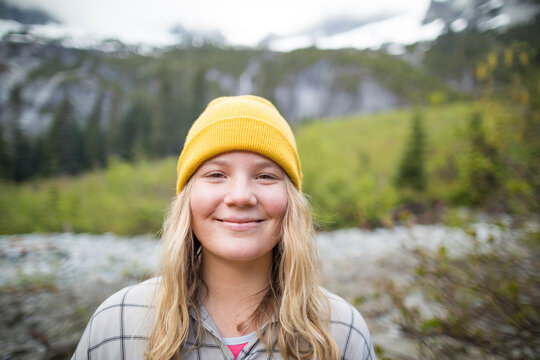 Portrait of a young womna in the mountains.