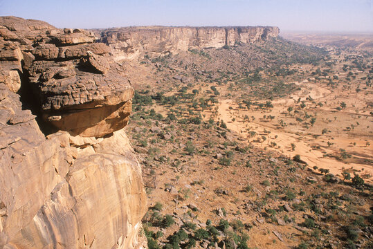 The Bandiagara Cliffs loom above the village of Ireli, Mali