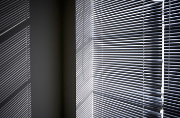 Light coming in through window blinds.